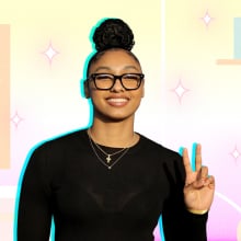 JuJu Watkins in her signature top bun and glasses, wearing a black long sleeve top. Behind her is an illustration of a desk and a guitar.