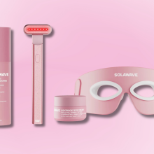 Four Solawave skincare products arranged on a pink background.