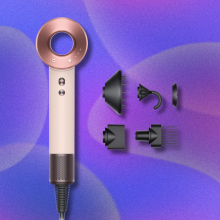 Dyson Supersonic Hair Dryer on purple and pink abstract background