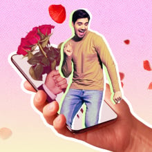 A man dancing on an iPhone surrounded by roses. 