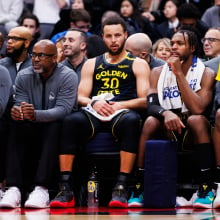  Stephen Curry #30 of the Golden State Warriors sits on the bench during first half of their NBA game against the Toronto Raptors at Scotiabank Arena on January 13, 2025 in Toronto, Canada. 