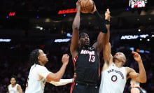 Bam Adebayo #13 of the Miami Heat rebounds the ball against the San Antonio Spurs during the third quarter of the game at Kaseya Center on January 19, 2025 in Miami, Florida.