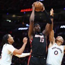 Bam Adebayo #13 of the Miami Heat rebounds the ball against the San Antonio Spurs during the third quarter of the game at Kaseya Center on January 19, 2025 in Miami, Florida.