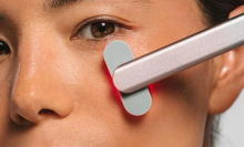 SolaWave skincare wand on woman's face