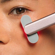 SolaWave skincare wand on woman's face