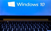 Windows 10 operating system logo is displayed on a laptop screen 