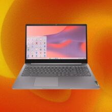 A Lenovo laptop appears on an orange, swirly abstract background.