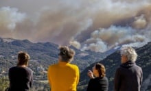 LA-area residents watch fires engulf the hills above Pacific Palisades.