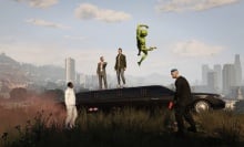 Two people stand atop a limo as a green alien jumps into the sky and one person on the ground looks at them while another, holding a red gun, looks into the distance. 