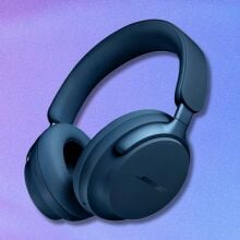 lunar blue bose quietcomfort ultra headphones on a purple and blue gradient background