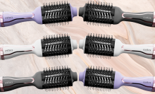 cortex beauty blowout brush in purple white and black mirrored against pink background