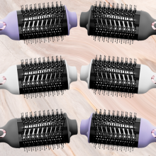 cortex beauty blowout brush in purple white and black mirrored against pink background