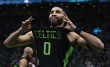 Jayson Tatum #0 of the Boston Celtics shows off his jersey to the fans before their game against the Toronto Raptors at TD Garden on December 31, 2024 in Boston, Massachusetts.