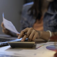 A woman does her taxes online.