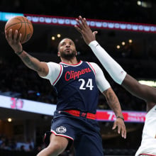 Norman Powell #24 of the LA Clippers goes to the basket against Jaren Jackson Jr. #13 of the Memphis Grizzlies during the second half at FedExForum on December 23, 2024 in Memphis, Tennessee. 