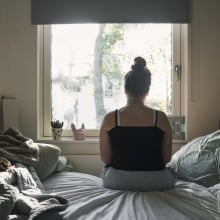 A teen in their bedroom.