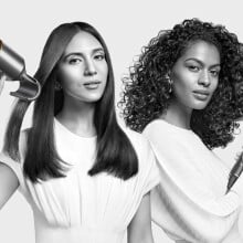 two people both use a dyson supersonic hair dryer