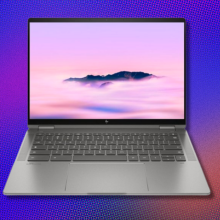 an hp chromebook plus in front of a purple, blue, and orange abstract background