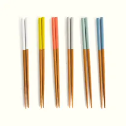 Six sets of colorful chopsticks on a light background