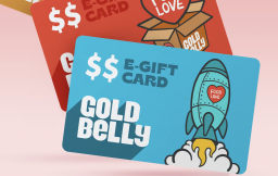 Graphic of two Goldbelly gift cards on a pink background