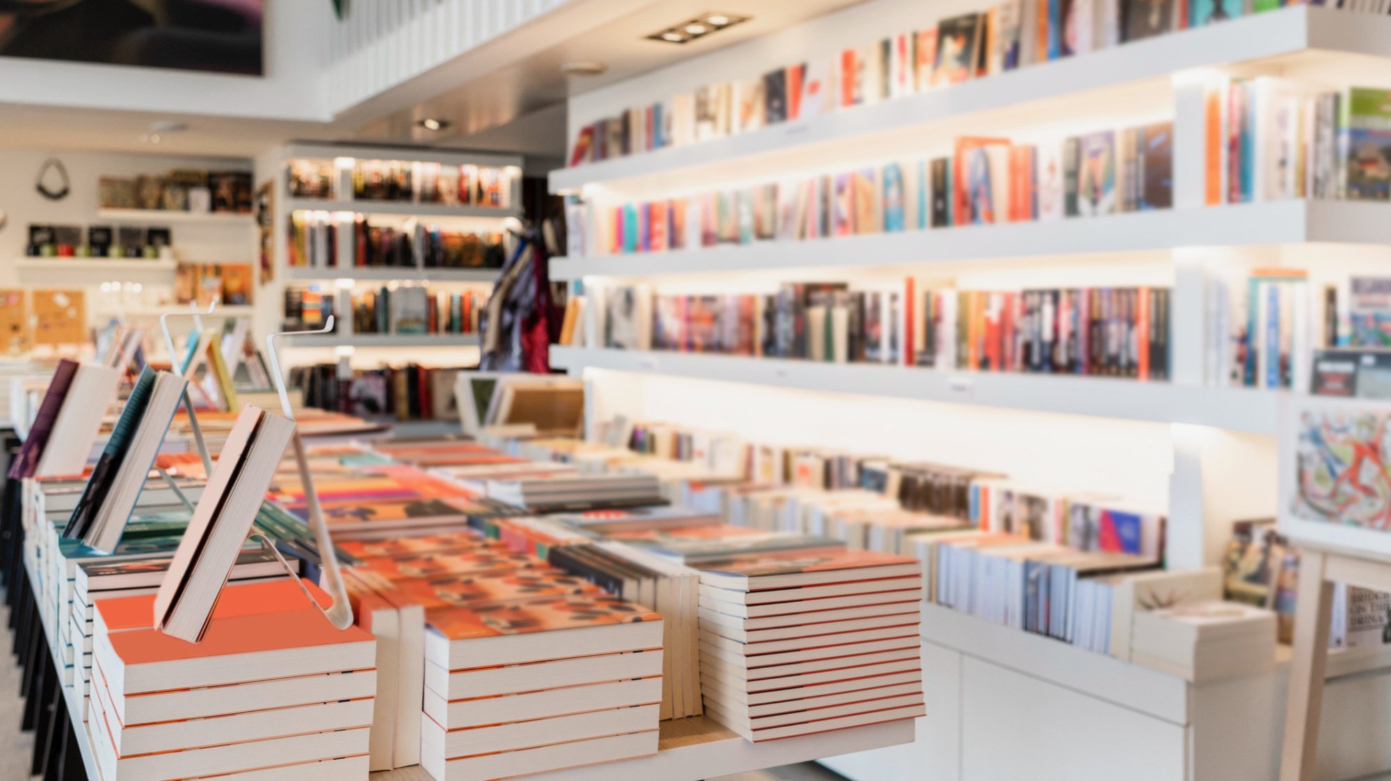 rows of books in brightly lit bookstore