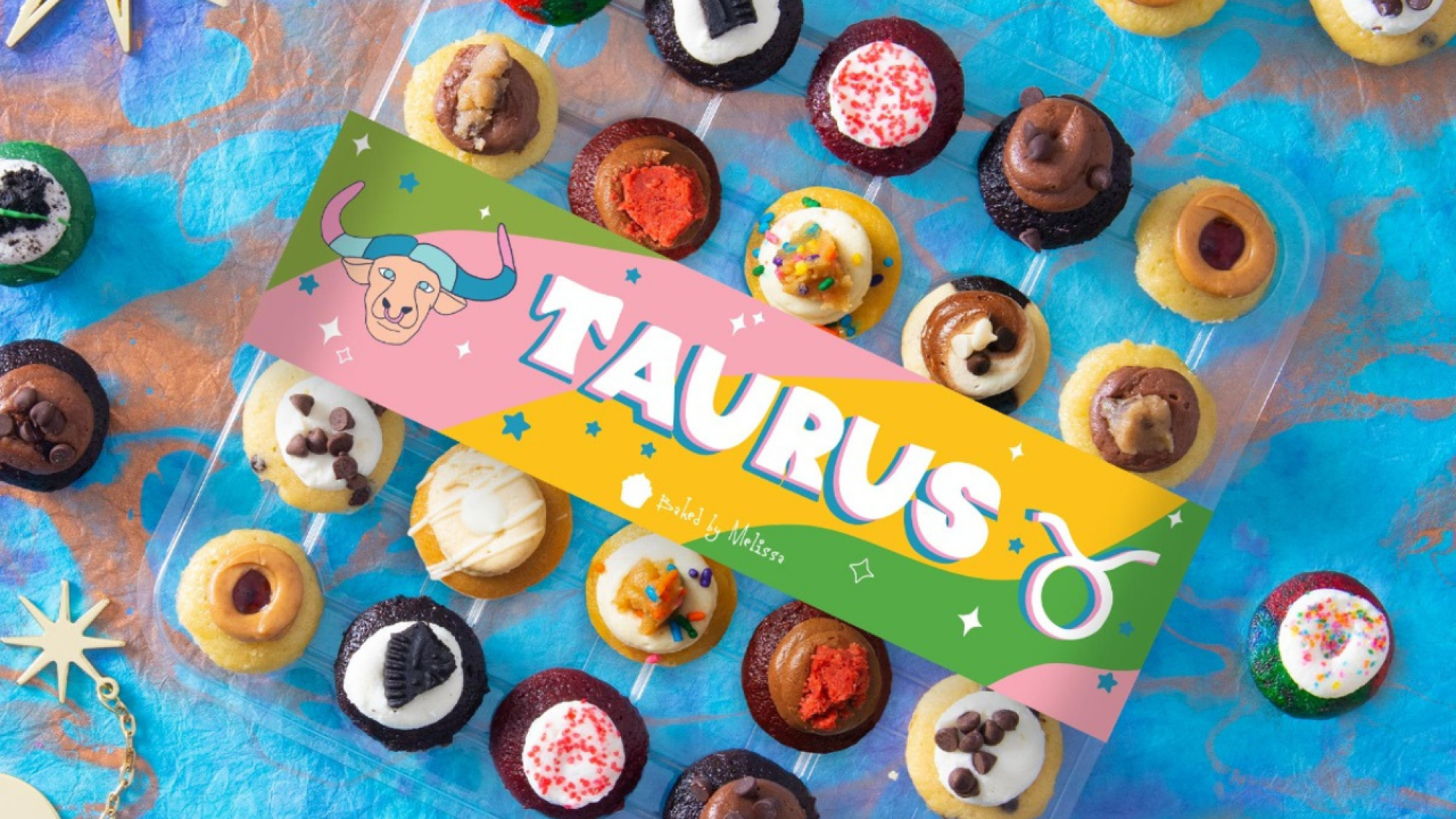 mini cupcakes in plastic casing with taurus banner