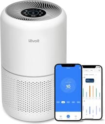 white cylindrical air purifier next to smartphone