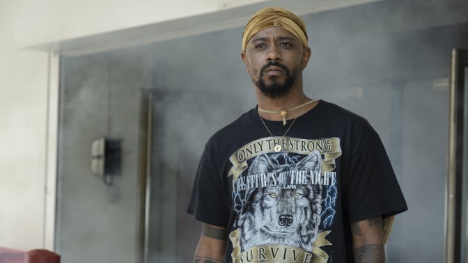 Darius, played by LaKeith Stanfield, stands in a department store with smoke in the background.