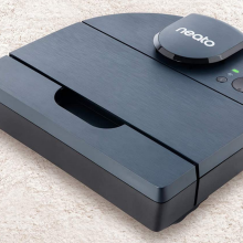 D-shaped robot vacuum on carpet