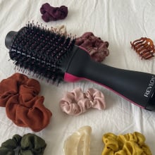 revlon one-step surrounded by scrunchies and hair clips