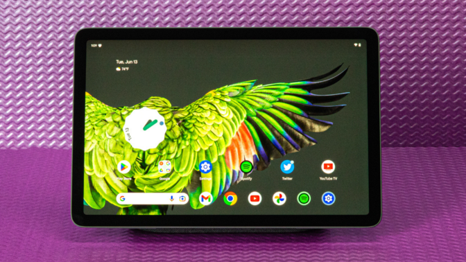 the Google Pixel Tablet against a purple background