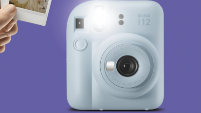 instax camera flashing against purple background