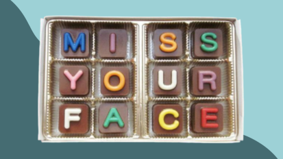 box of chocolates that reads "miss your face" 