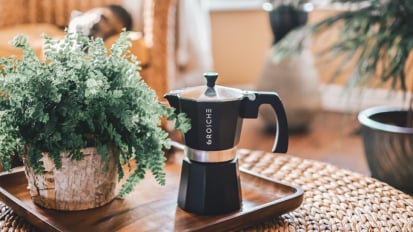 A Moka pot from Grosche on a wooden table.