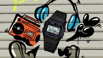 a casio digital watch in front of graffiti background