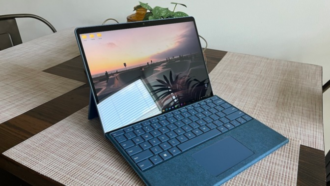 a microsoft surface pro 9 with its keyboard on a kitchen table