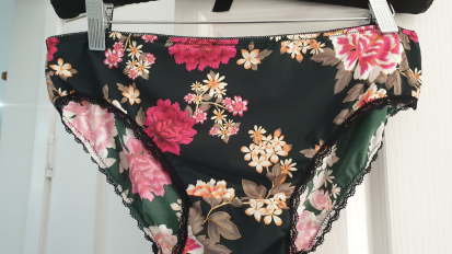 floral underwear hanging on hanger