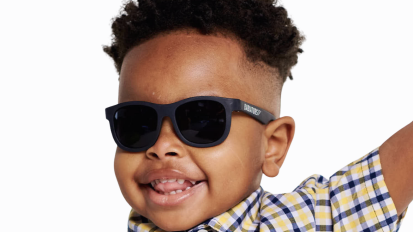 young Black boy wearing babiators sunglasses