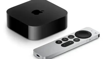 An Apple TV 4K device with remote