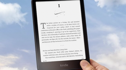 Kindle Paperwhite device against a blue sky background