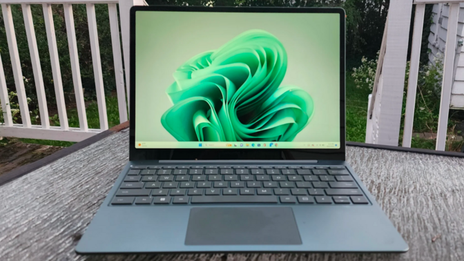 a microsoft surface laptop go 3 on a patio table