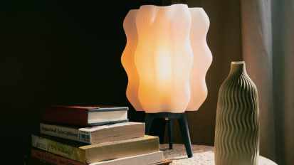 A Wooj Wavy lamp styled on a side table.