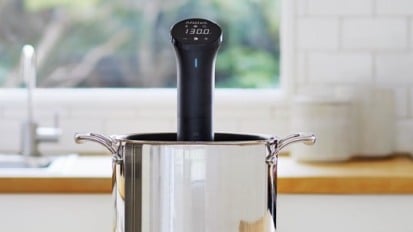 A smart sous vide machine in a kitchen.