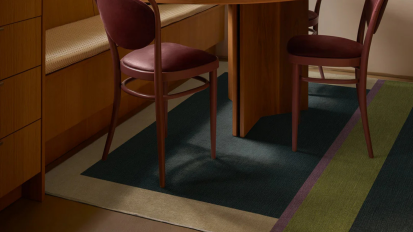 A Ruggable rug under a dining room table.