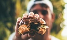 man holding burger