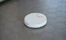 Robot vacuum on tile floor