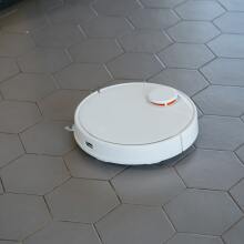 Robot vacuum on tile floor