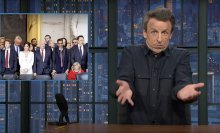 Seth Meyers with his arms outstretched and an exasperated expression on his face. 