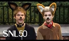 two men dressed in dog costumes and makeup