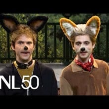 two men dressed in dog costumes and makeup